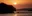 a sunset over a body of water